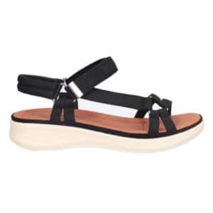 Perfil de sandalia Kangaroos negra con cuña de 3 cm en EVA blanca y cierre de velcro ajustable.